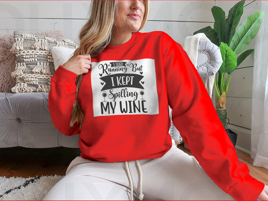 A cozy sweatshirt featuring the humorous phrase 'I Tried Running But I Kept Spilling My Wine', perfect for wine lovers.